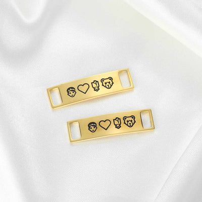 Custom engraved shoelace charms in gold with personalised font by TrulyMineCo. Made of durable stainless steel and plated with 18K gold